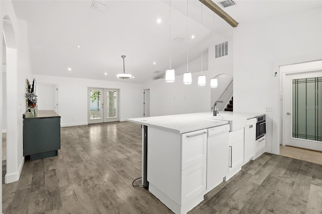 23 Essington Ln, Palm Coast, FL 32164 - kitchen with beamed ceiling, white cabinets, dishwasher, and visible vents