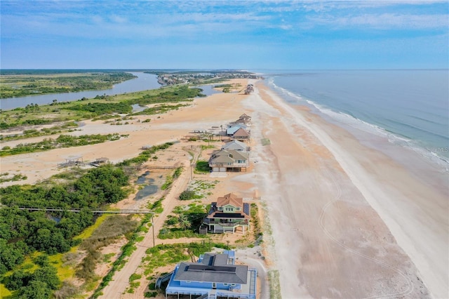 bird's eye view featuring a view of the beach and a water view