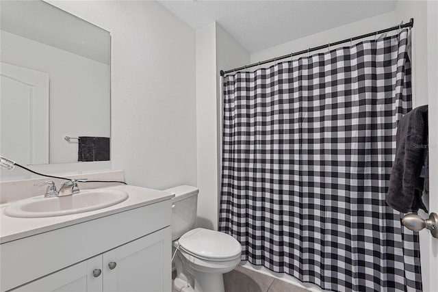 bathroom with toilet, curtained shower, and vanity