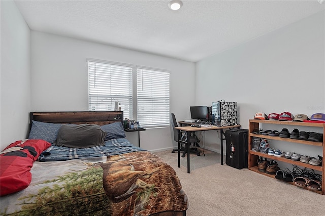 bedroom with baseboards and carpet flooring