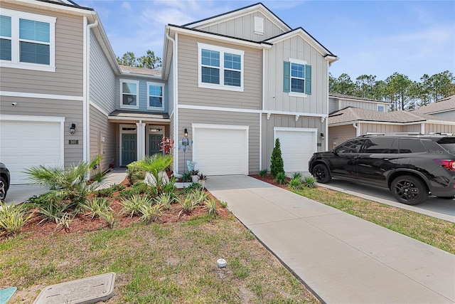 view of front of property featuring an attached garage, board and batten siding, and concrete driveway