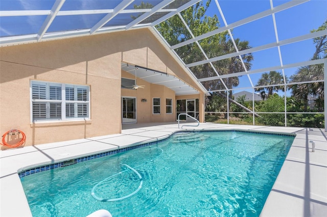pool featuring a patio, ceiling fan, and a lanai
