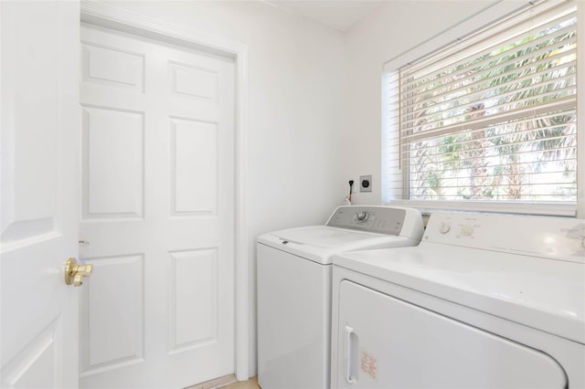 washroom featuring independent washer and dryer and laundry area