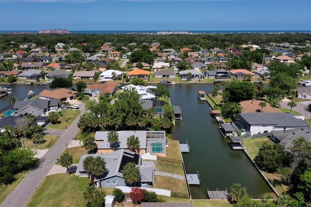drone / aerial view featuring a water view and a residential view