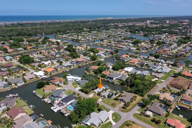 aerial view with a water view and a residential view