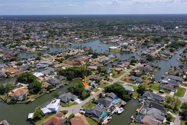 aerial view with a residential view and a water view