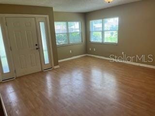 39 Bird Of Paradise Dr, Palm Coast, FL 32137 - foyer entrance featuring baseboards and wood finished floors