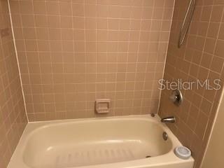 39 Bird Of Paradise Dr, Palm Coast, FL 32137 - full bathroom featuring bathing tub / shower combination