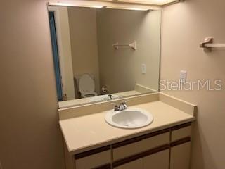 39 Bird Of Paradise Dr, Palm Coast, FL 32137 - bathroom with vanity and toilet