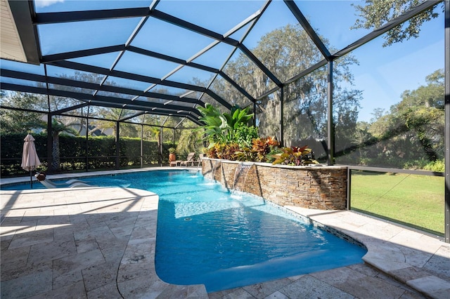 swimming pool with a patio area and a lawn