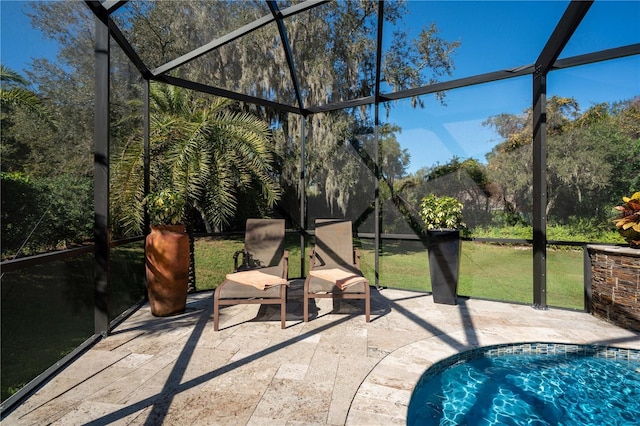 view of patio featuring a lanai and an outdoor pool