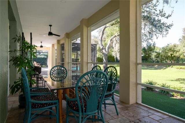 sunroom / solarium with ceiling fan