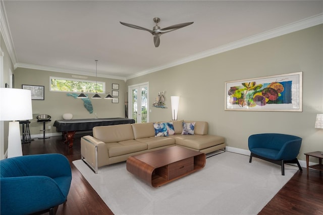 living area featuring wood finished floors, baseboards, ornamental molding, ceiling fan, and billiards