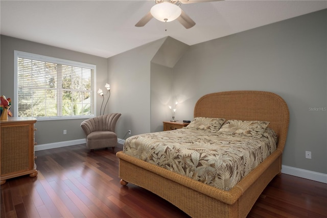 bedroom featuring baseboards, wood finished floors, and a ceiling fan