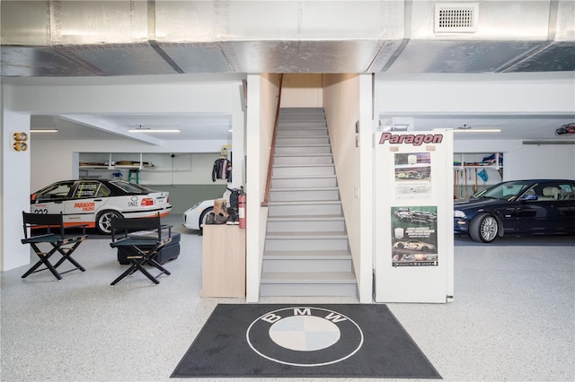 staircase featuring speckled floor