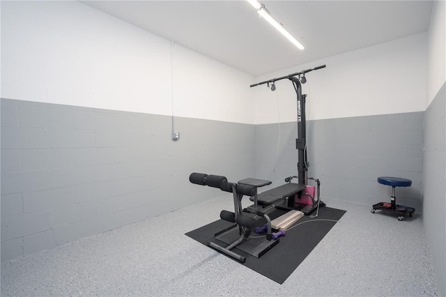 exercise area with concrete block wall