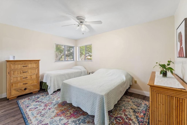 25 Westlawn Pl, Palm Coast, FL 32164 - bedroom with baseboards, ceiling fan, and dark wood-type flooring