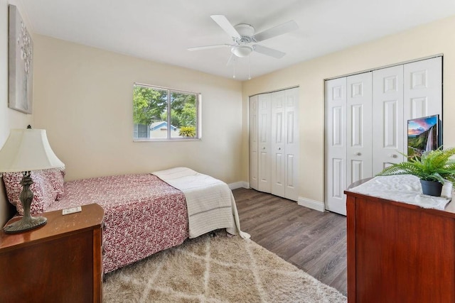 25 Westlawn Pl, Palm Coast, FL 32164 - bedroom with two closets, baseboards, ceiling fan, and wood finished floors