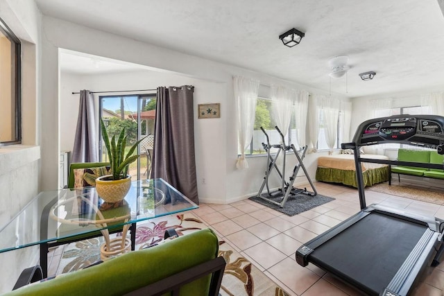 25 Westlawn Pl, Palm Coast, FL 32164 - workout area with tile patterned flooring and baseboards