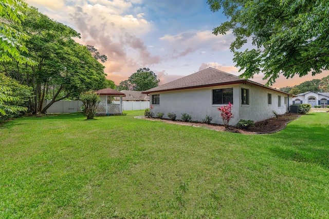 25 Westlawn Pl, Palm Coast, FL 32164 - yard at dusk with fence