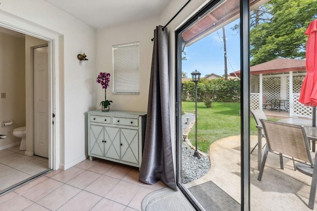 25 Westlawn Pl, Palm Coast, FL 32164 - doorway with baseboards and light tile patterned flooring