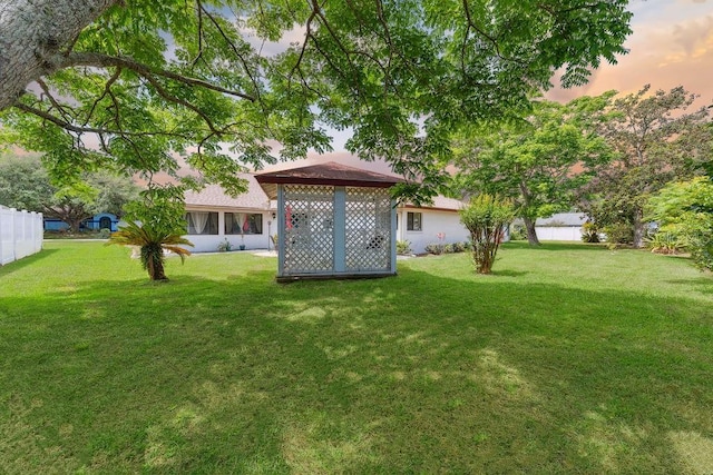 25 Westlawn Pl, Palm Coast, FL 32164 - view of yard featuring fence and a gazebo