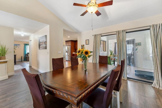 25 Westlawn Pl, Palm Coast, FL 32164 - dining space featuring baseboards, ceiling fan, vaulted ceiling, and wood finished floors