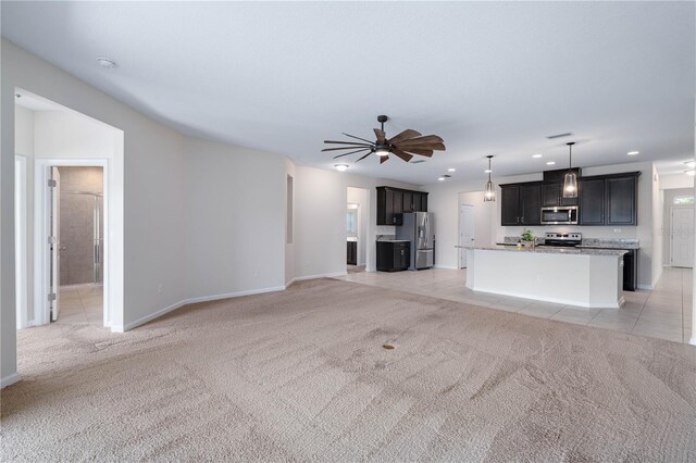 unfurnished living room featuring light carpet, baseboards, recessed lighting, a ceiling fan, and light tile patterned flooring