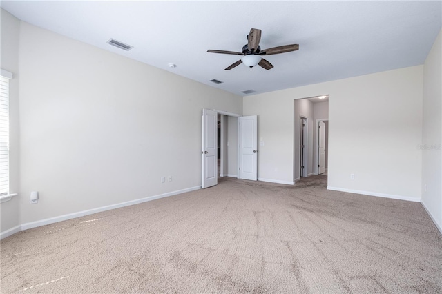 unfurnished bedroom featuring carpet flooring, baseboards, and a ceiling fan