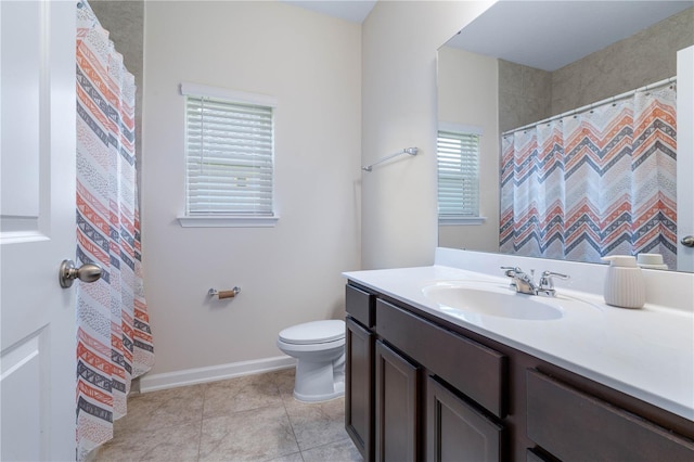 bathroom featuring toilet, vanity, baseboards, tile patterned floors, and curtained shower