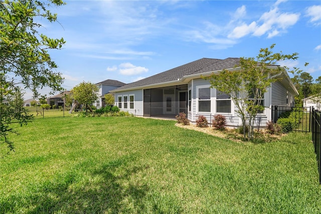 back of property with a sunroom