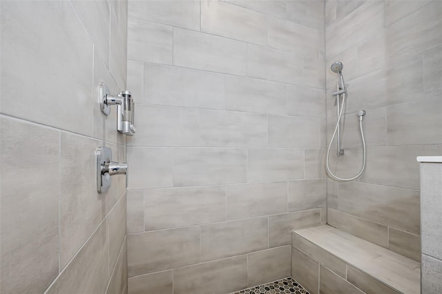 bathroom featuring tiled shower