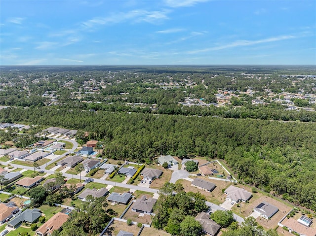 birds eye view of property with a residential view and a view of trees