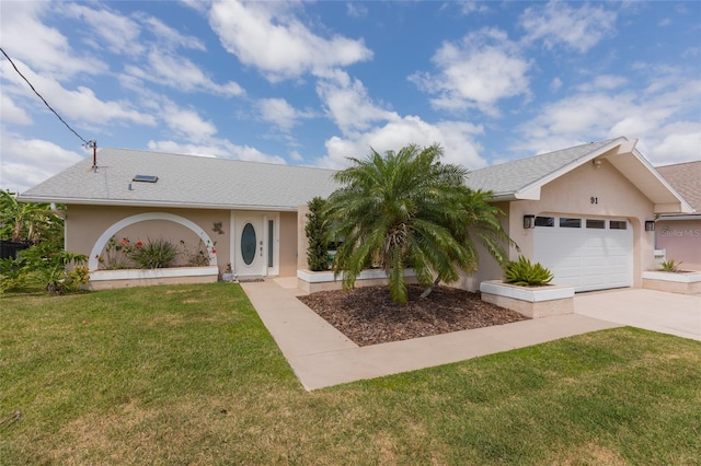 ranch-style house featuring an attached garage, a front lawn, driveway, and stucco siding