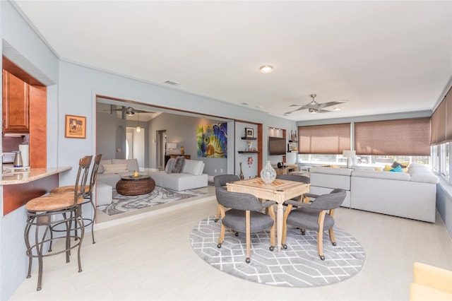 dining room with a ceiling fan and visible vents