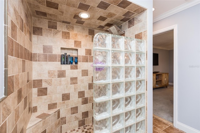 bathroom featuring crown molding, a walk in shower, baseboards, and tile patterned flooring