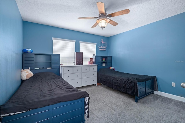 carpeted bedroom with a textured ceiling and ceiling fan