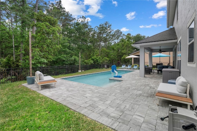 view of swimming pool featuring an outdoor living space, a ceiling fan, a fenced in pool, a fenced backyard, and a patio