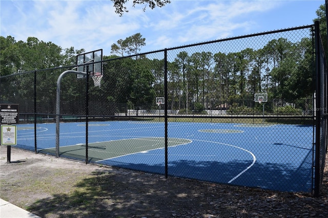 view of sport court featuring community basketball court and fence