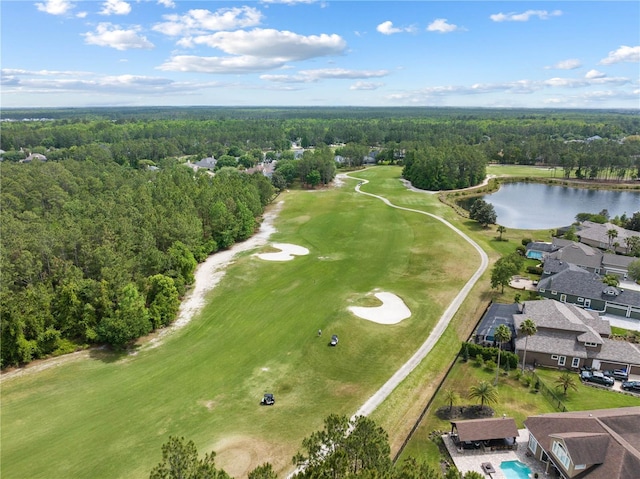 birds eye view of property with a water view, golf course view, and a forest view