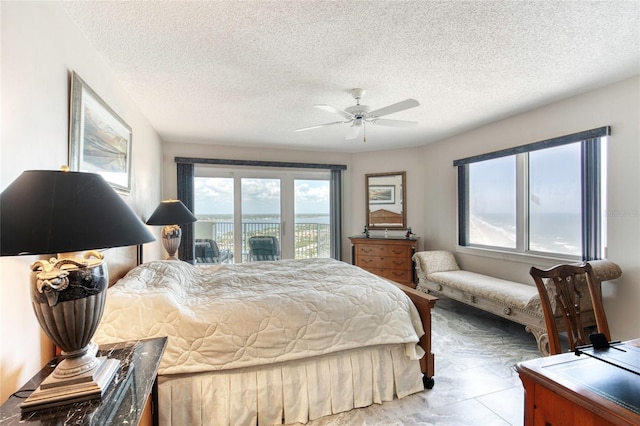 2937 S Atlantic Ave Unit 2001, Daytona Beach, FL 32118 - bedroom featuring a ceiling fan, a textured ceiling, and access to exterior