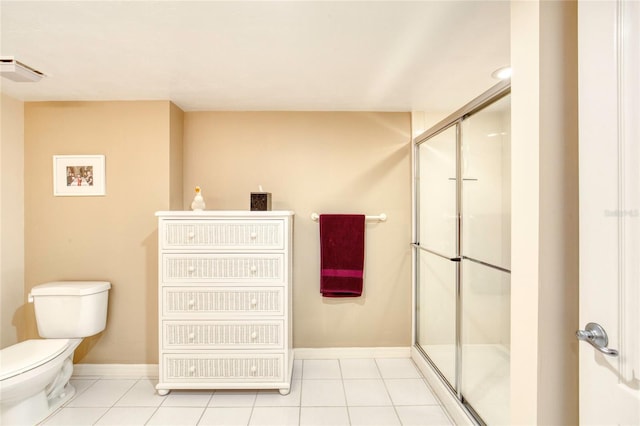 2937 S Atlantic Ave Unit 2001, Daytona Beach, FL 32118 - full bathroom with a stall shower, toilet, baseboards, and tile patterned floors