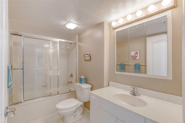 2937 S Atlantic Ave Unit 2001, Daytona Beach, FL 32118 - full bath featuring toilet, enclosed tub / shower combo, tile patterned floors, a textured ceiling, and vanity