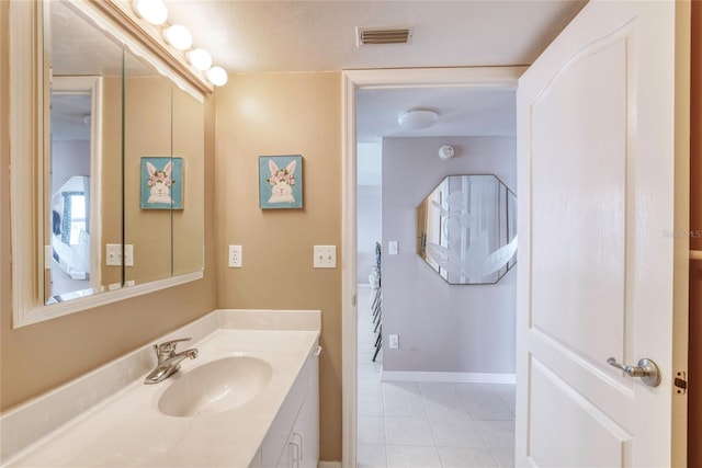 2937 S Atlantic Ave Unit 2001, Daytona Beach, FL 32118 - bathroom with baseboards, visible vents, tile patterned flooring, and vanity