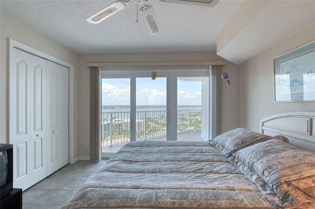 2937 S Atlantic Ave Unit 2001, Daytona Beach, FL 32118 - bedroom with a water view, multiple windows, access to outside, and ceiling fan