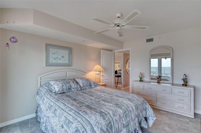 2937 S Atlantic Ave Unit 2001, Daytona Beach, FL 32118 - bedroom featuring baseboards, a textured ceiling, visible vents, and a ceiling fan