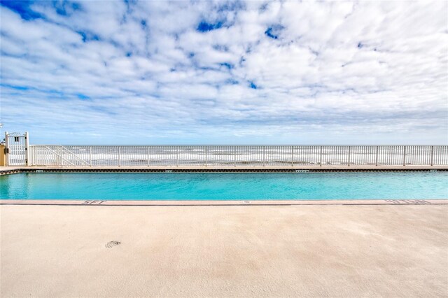 2937 S Atlantic Ave Unit 2001, Daytona Beach, FL 32118 - pool with a patio area and fence