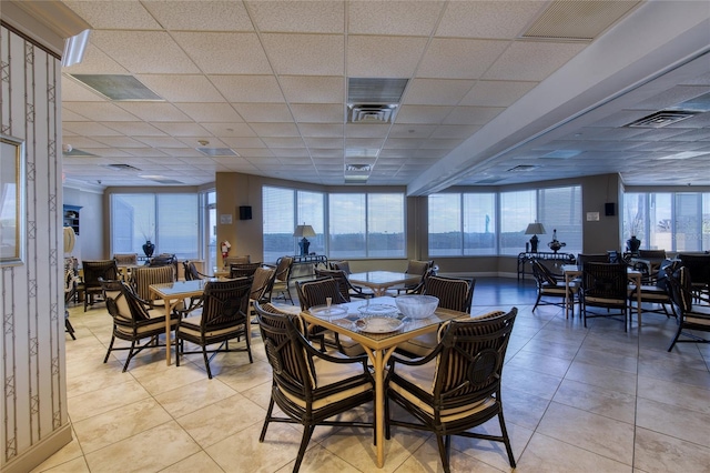 2937 S Atlantic Ave Unit 2001, Daytona Beach, FL 32118 - dining space with light tile patterned floors, a drop ceiling, and visible vents