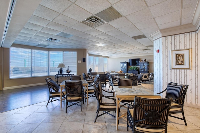 2937 S Atlantic Ave Unit 2001, Daytona Beach, FL 32118 - dining room featuring a paneled ceiling, light tile patterned flooring, baseboards, and visible vents