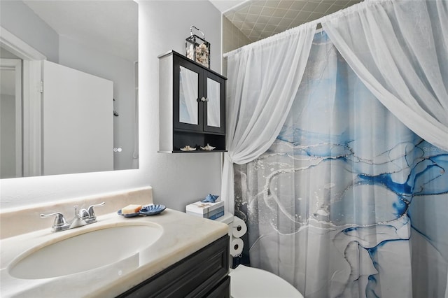 bathroom with vanity, toilet, and a shower with curtain